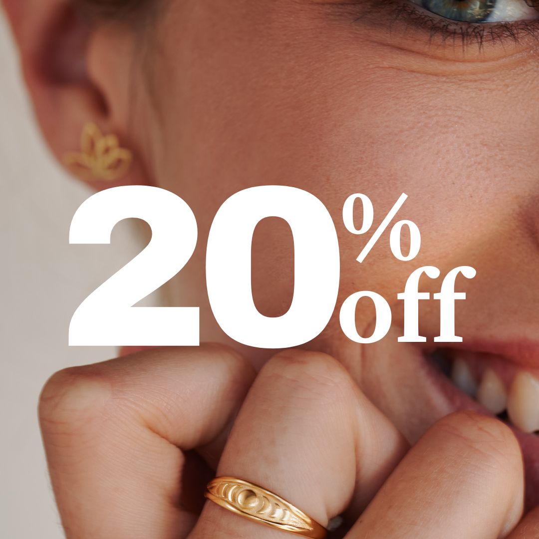 Close-up of a woman with golden jewelry and 20% off text.