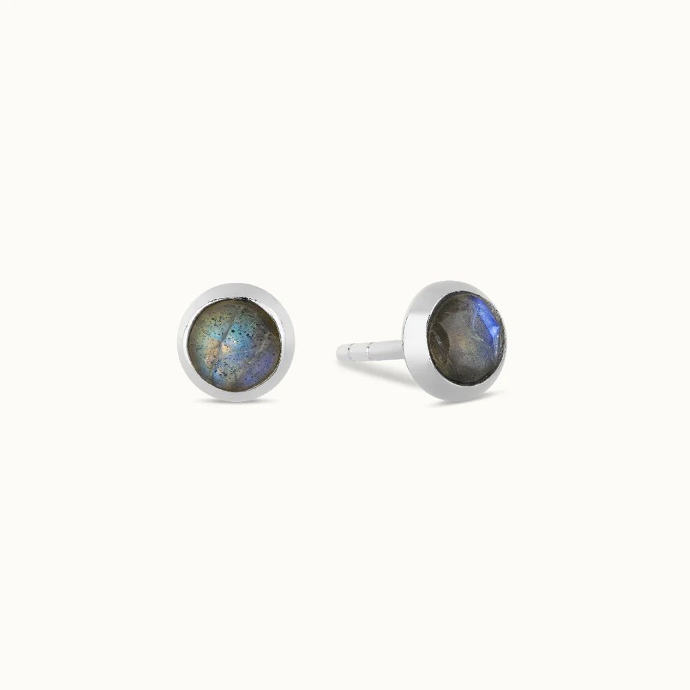 Two silver stud earrings with round labradorite stones.