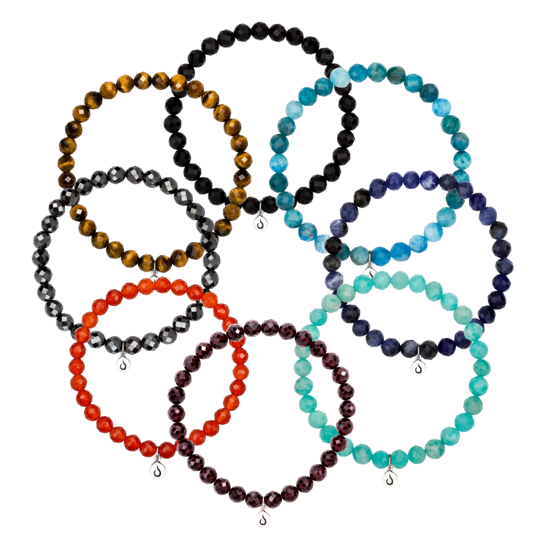 Nine colorful, faceted bead bracelets arranged in an overlapping circular pattern on a white background.