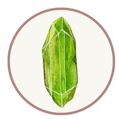 Illustration of a green crystal within a circular frame.