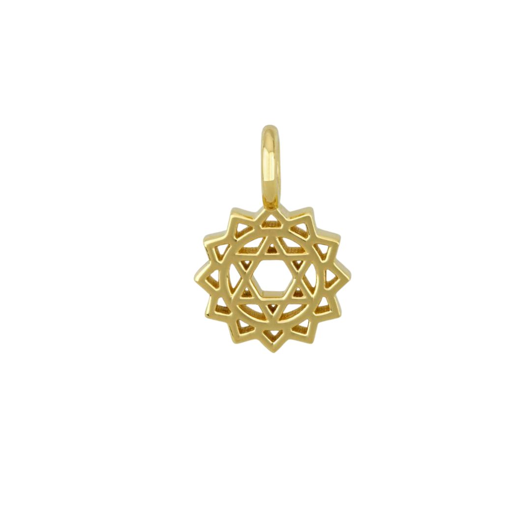 A gold pendant with a geometric, twelve-pointed star design against a white background.