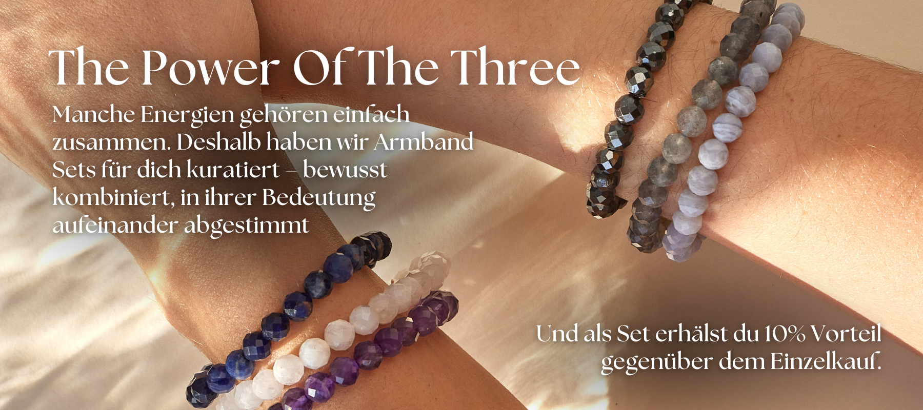 Two arms cross, displaying several bracelets made of colorful, faceted beads, with German text overlaid.