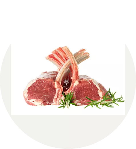 Two raw lamb chops with rosemary sprigs.