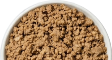 A close-up top view of a white bowl filled with a brown, crumbled substance.