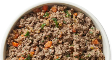 A close-up shot of cooked ground meat mixed with chopped vegetables in a white bowl.