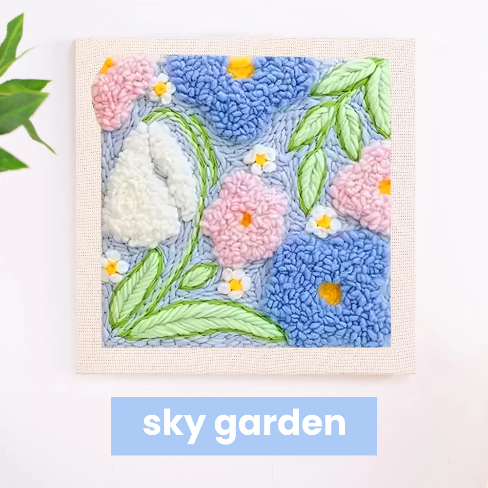 Colorful embroidered flowers and leaves on fabric with 'sky garden' text below.