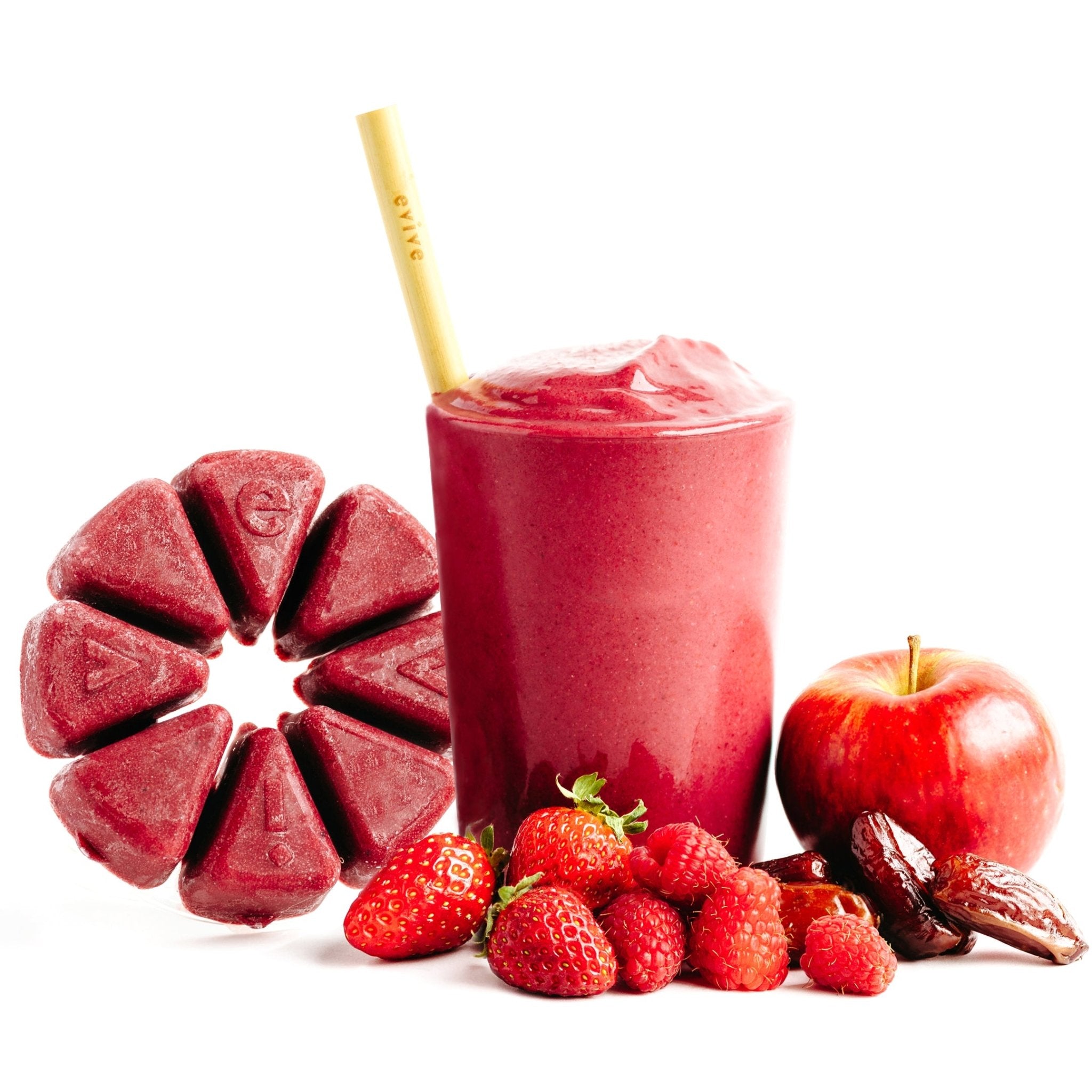 Red smoothie with strawberries, raspberries, apple, dates, and ice cubes arranged on white background.