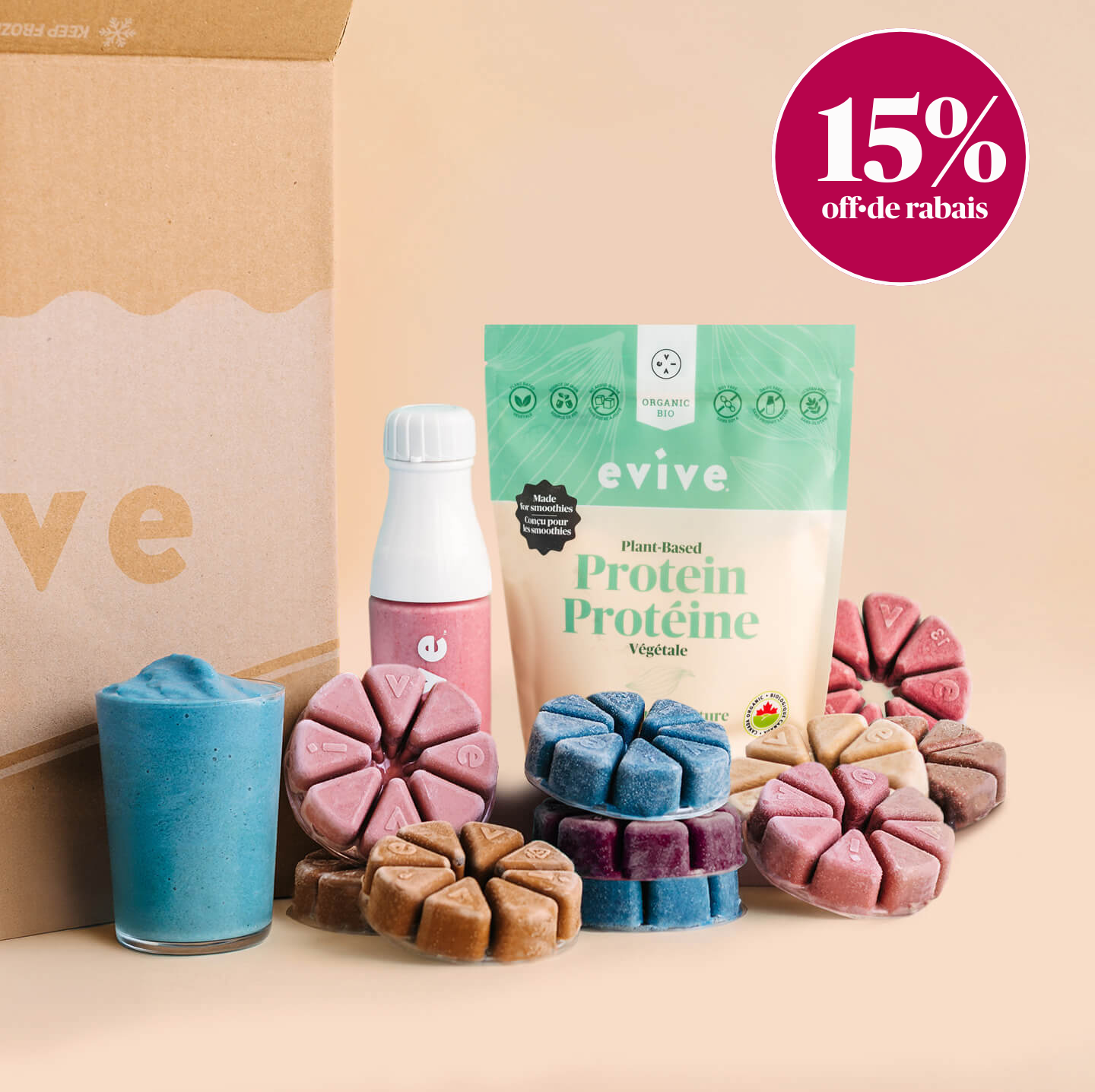 An assortment of Evive smoothie products, including protein powder, colorful frozen pucks, and prepared smoothies next to a box.