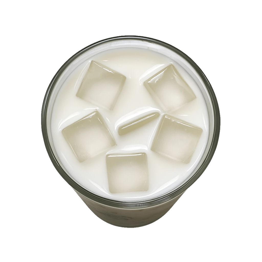 Glass of milk with ice cubes, viewed from above.