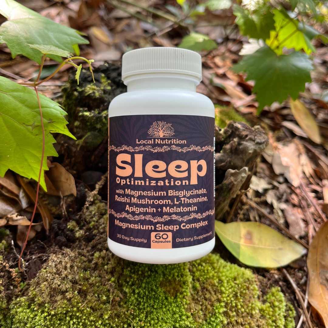 Supplement bottle labeled 'Sleep Optimization' with leaves and forest floor background.