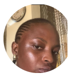 A close-up, circular-cropped photo of a Black woman with her hair in cornrows looking towards the camera.