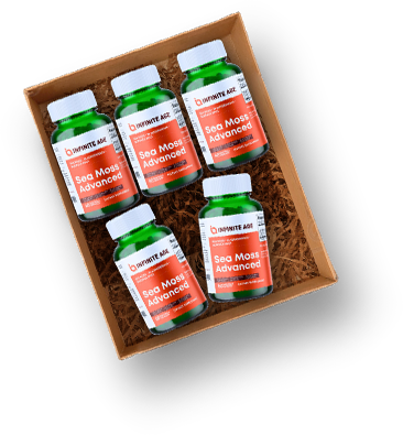 Box containing six green bottles labeled 'Sea Moss Advanced' on straw padding.