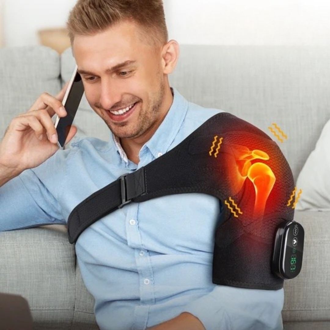 Person wearing a shoulder brace while talking on the phone and sitting on a sofa.