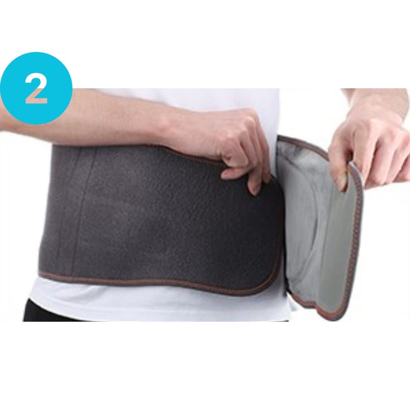 Person wearing and adjusting a black waist support belt.