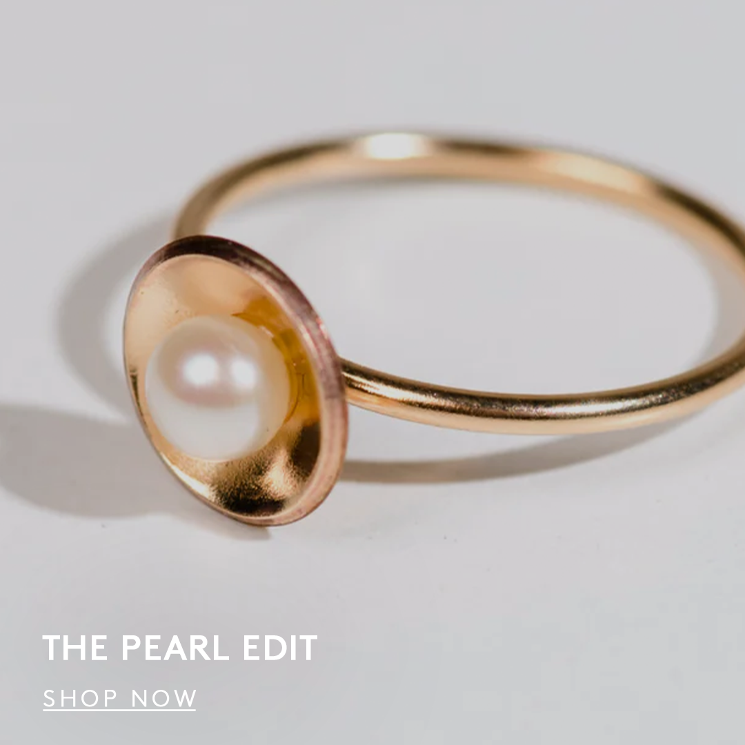 Gold ring with a pearl, text reads 'The Pearl Edit, Shop Now button