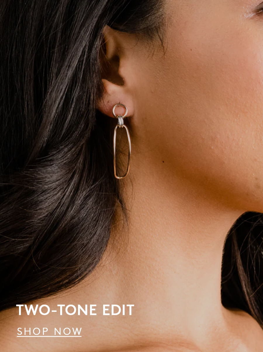 woman wearing two-tone drop earrings, text reads two-tone edit, shop now