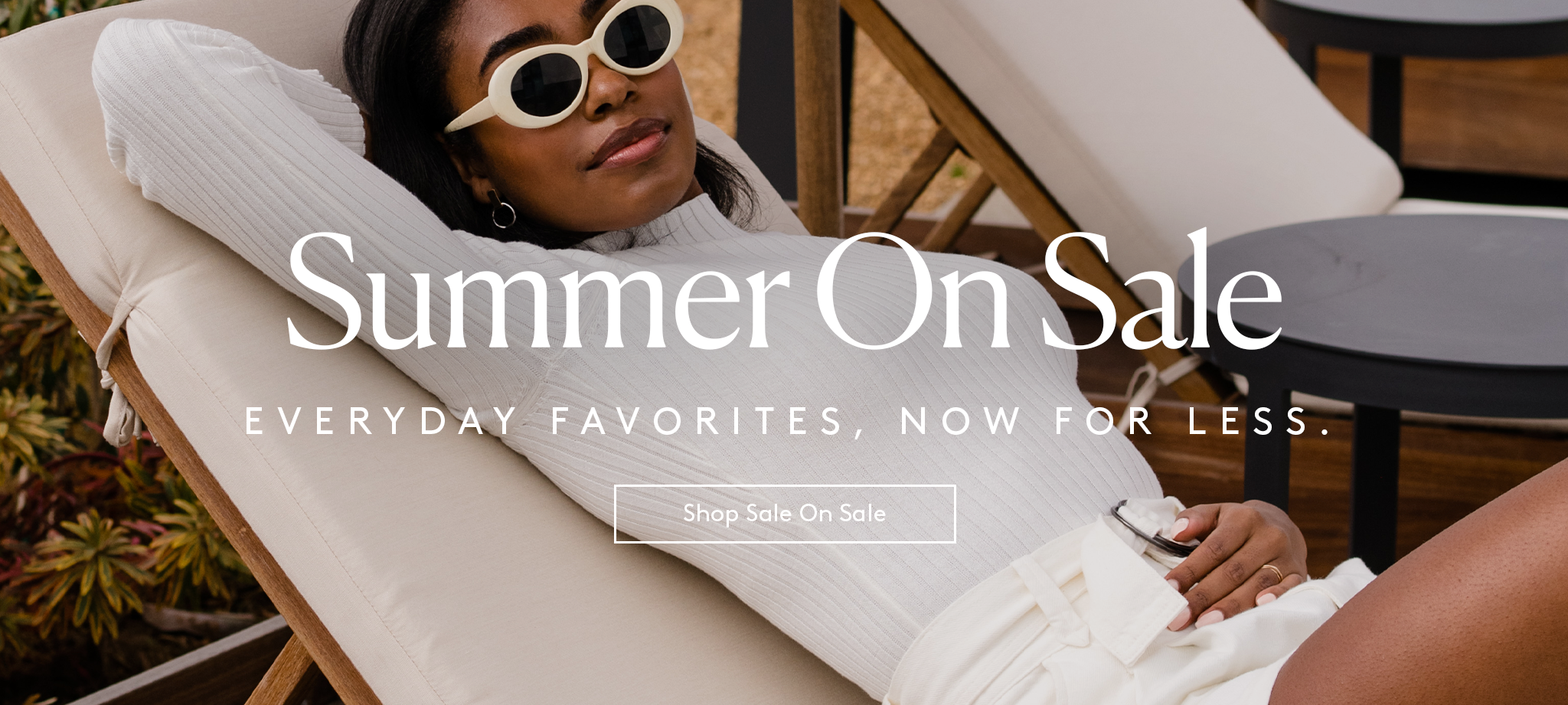 woman relaxing on a pool lounge chair in an all white outfit with sunglasses, text reads summer on sale, everyday favorites, now for less, shop sale on sale button