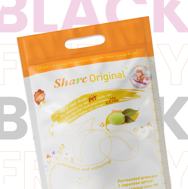 Woman smiling with Share Original snack products and promotional labels.