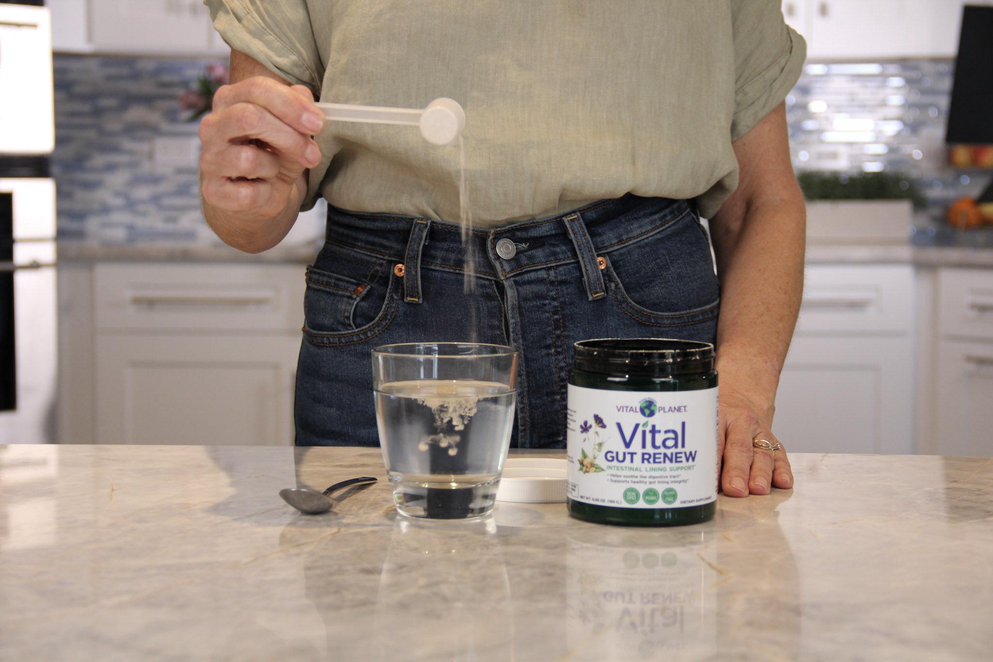 Mixing Vital Gut Renew powder into water, best taken on an empty stomach
