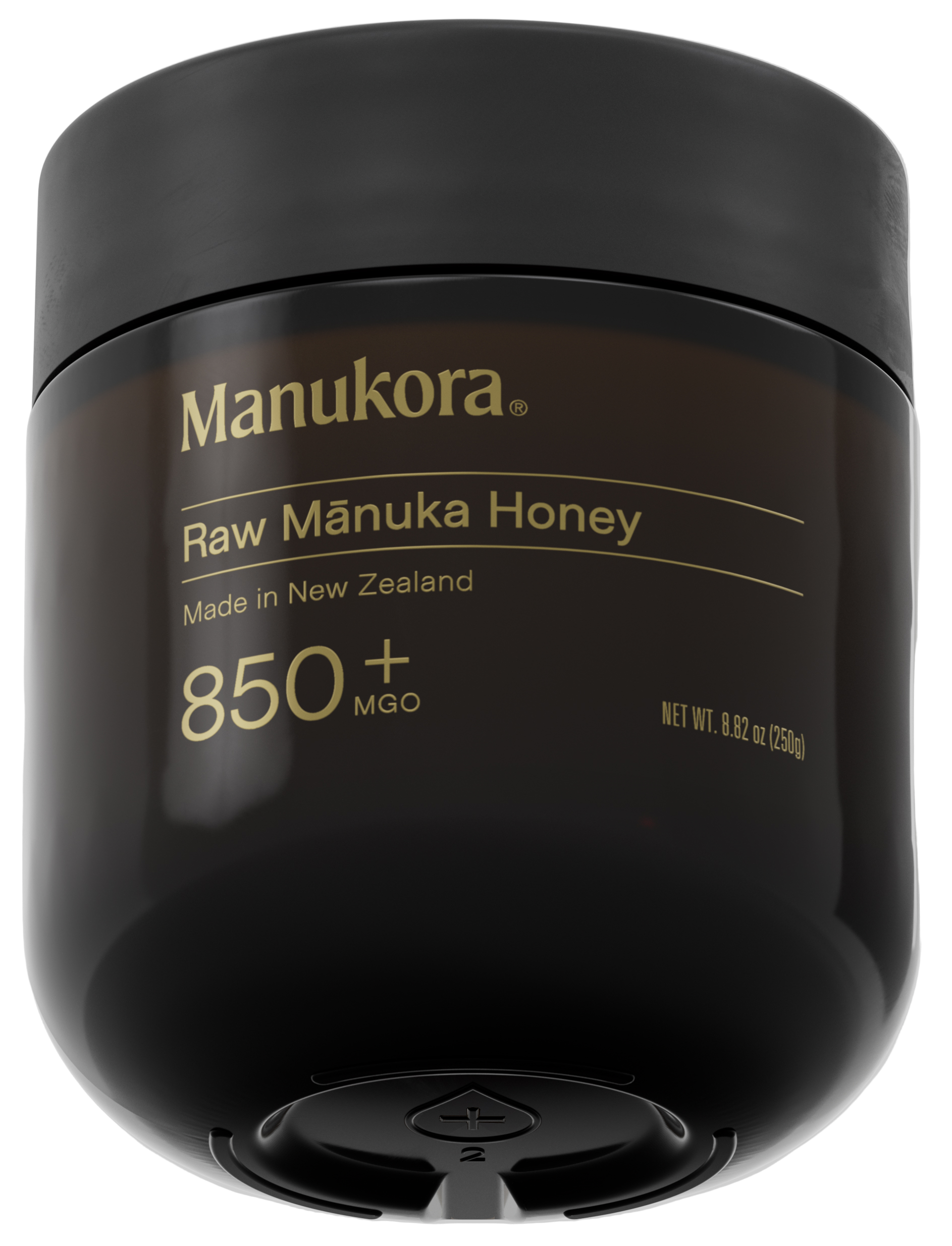 A black jar labeled 'Manukora Raw Mānuka Honey 850+ MGO' with a black lid.