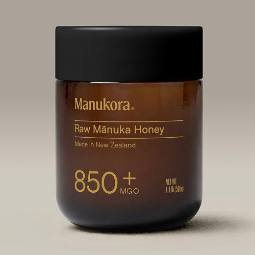 A jar of Manukora Raw Mānuka Honey with 850+ MGO label.