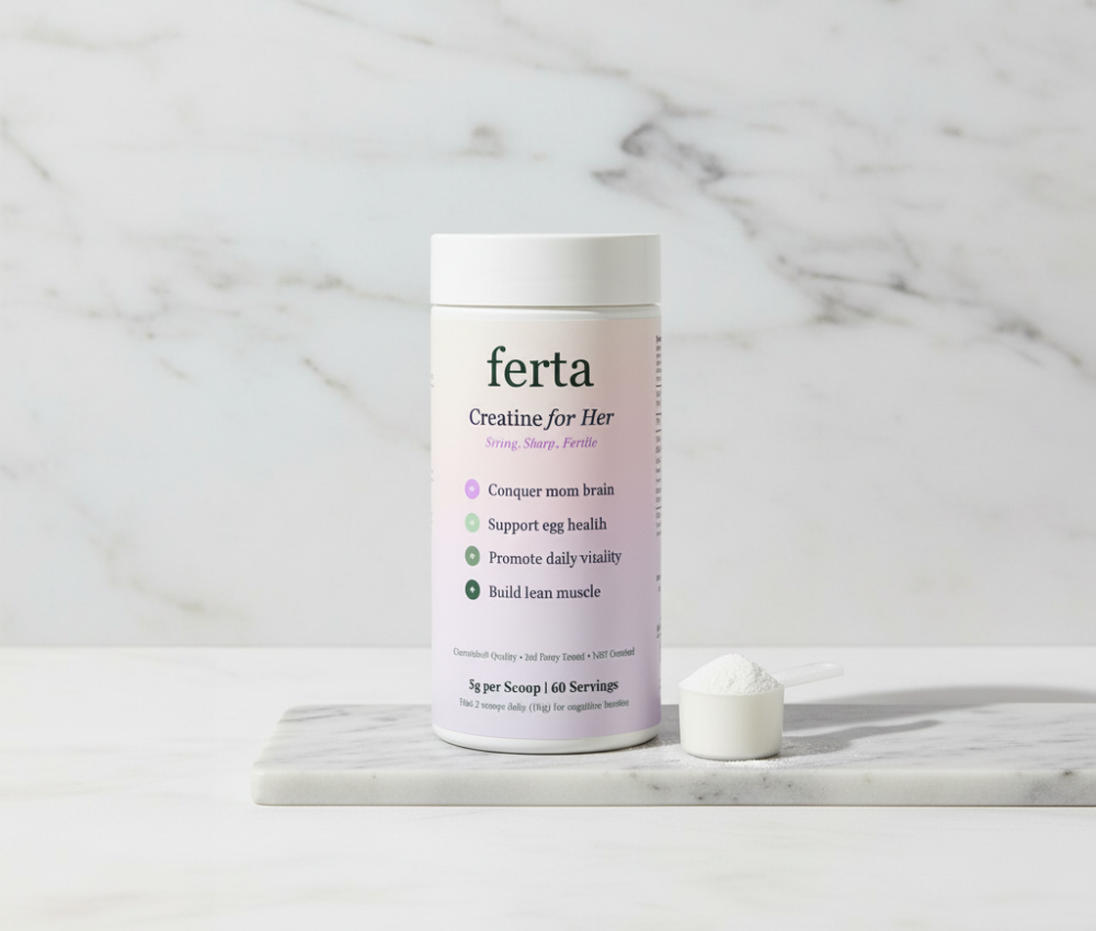 Tub of 'ferta' creatine and scoop on marble surface.