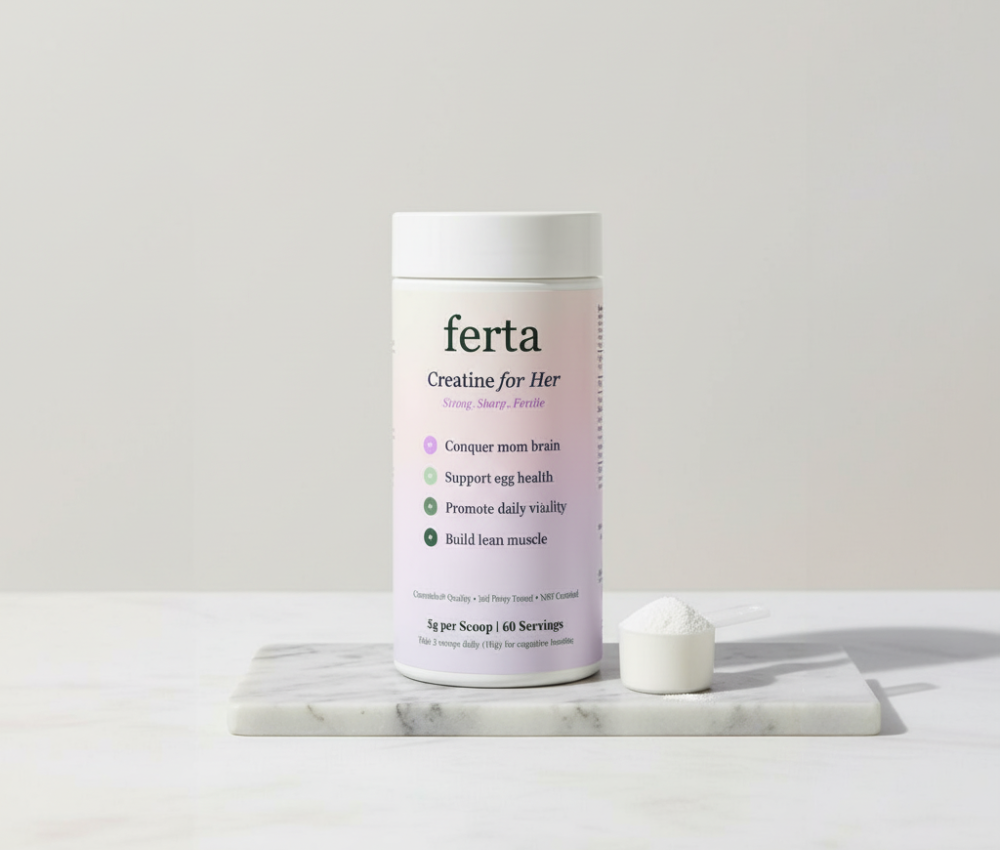 Container of creatine for women on marble surface with scoop of powder.