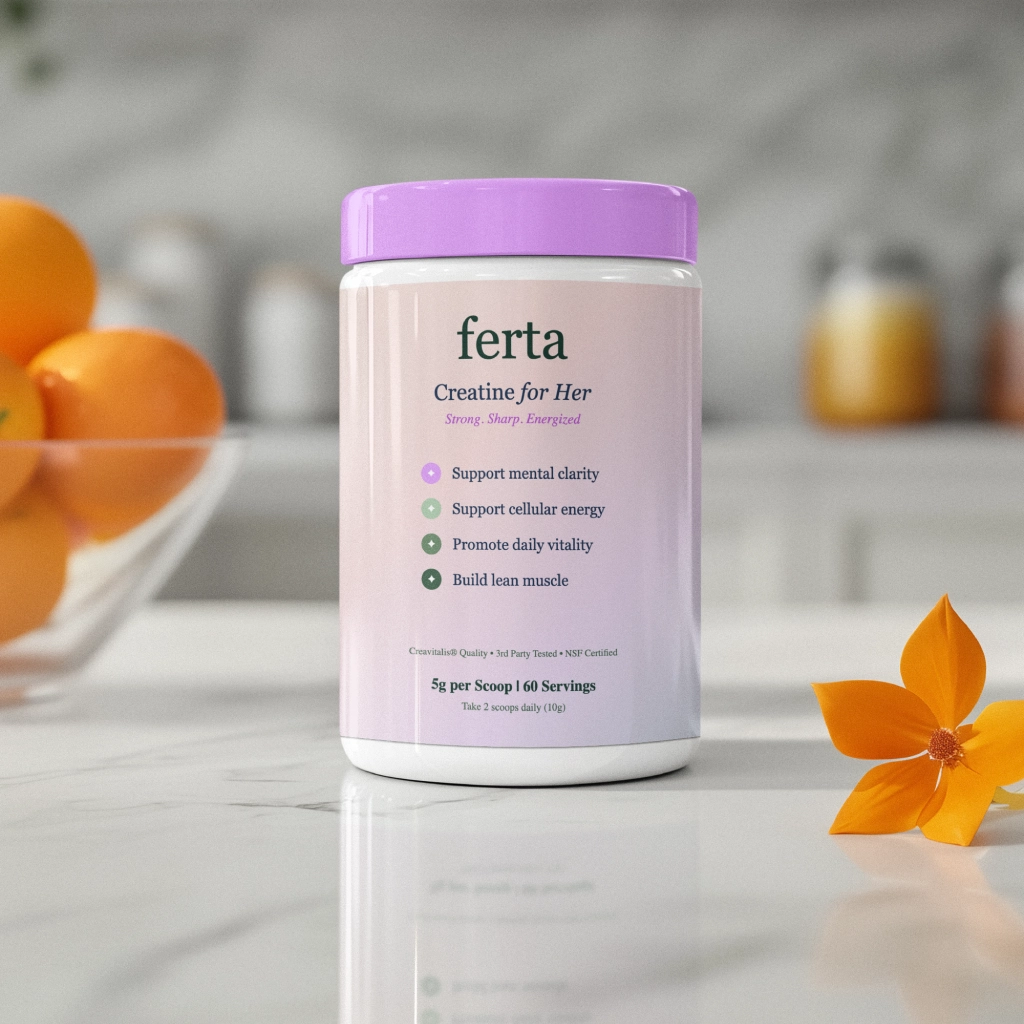 Container of creatine supplement with purple lid, surrounded by oranges and an orange flower.