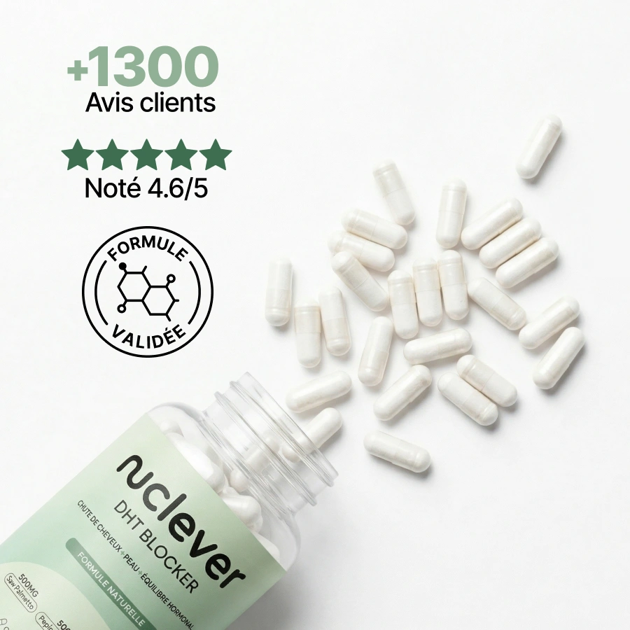An open bottle of Nucleyer DHT Blocker with white capsules spilling out onto a white surface.