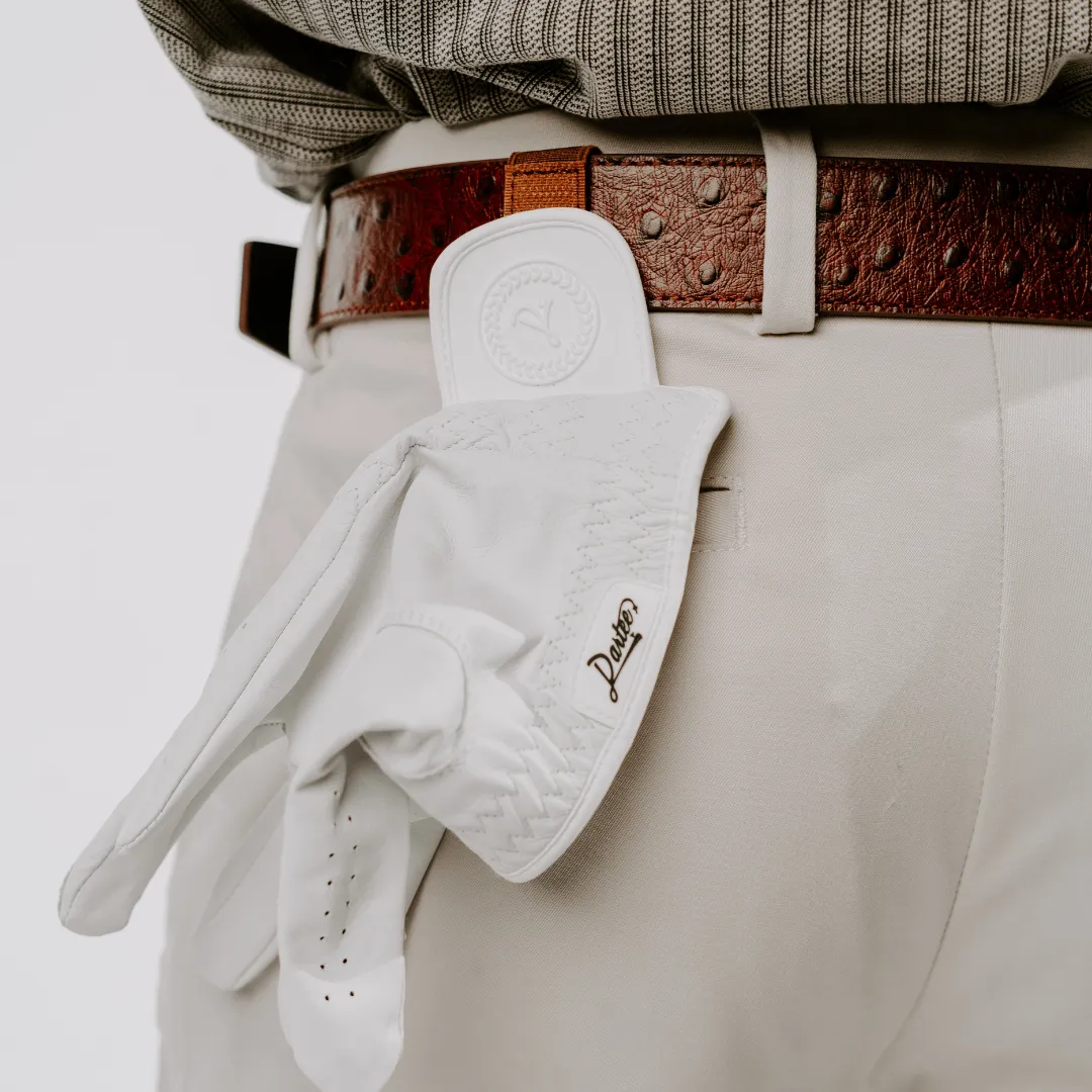 White golf glove tucked into a brown leather belt.