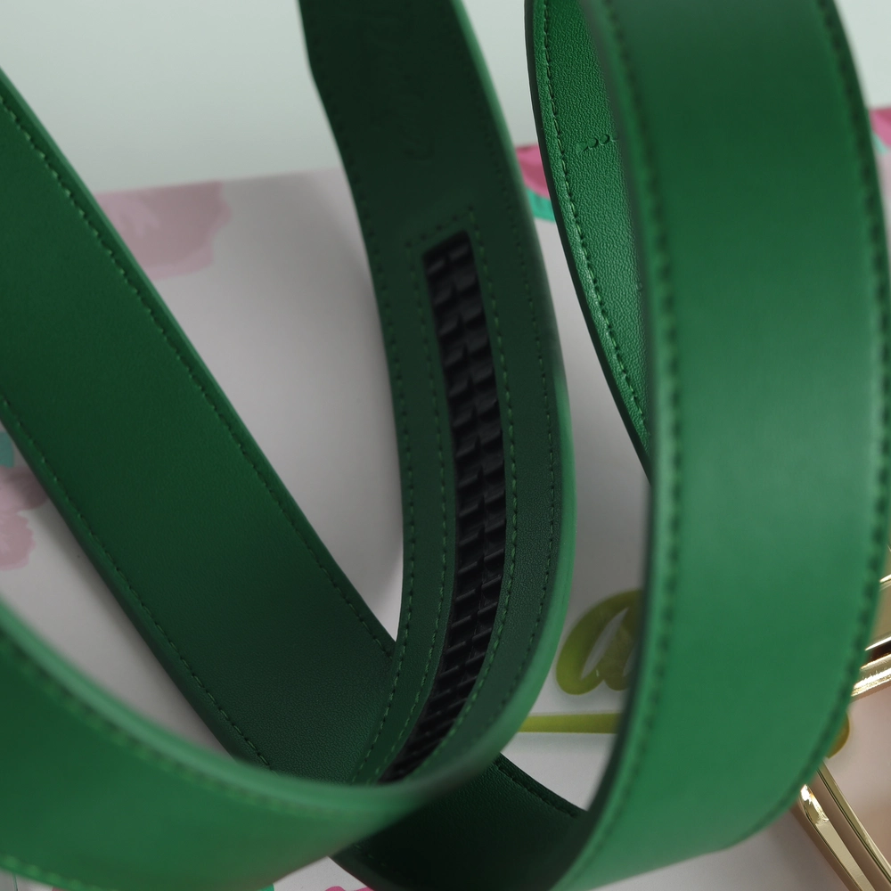 Close-up of a green leather strap with stitching details.