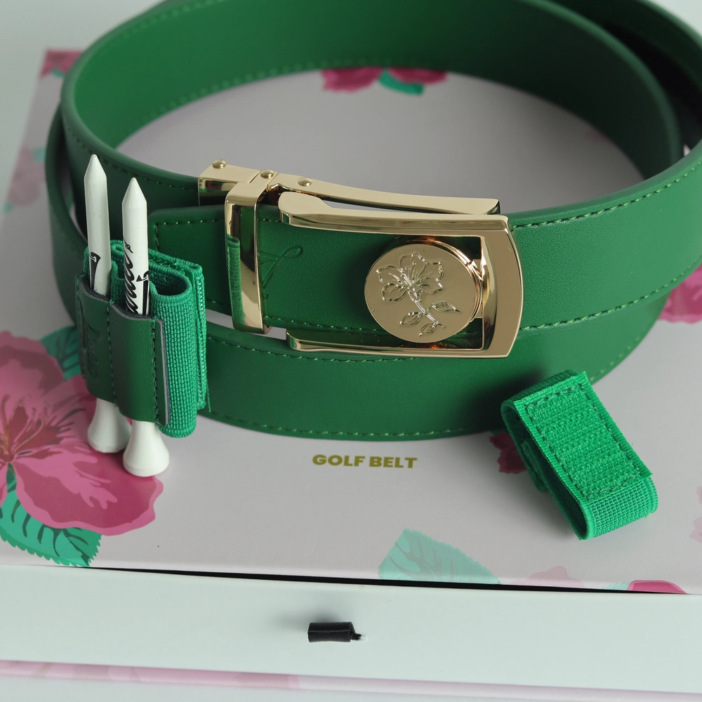 Green golf belt with gold buckle and floral design, on floral box.