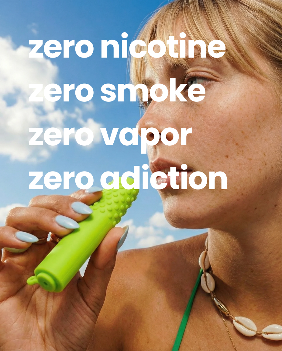 A person holds a green, textured device to their mouth. Text reads: zero nicotine, smoke, vapor, adiction.