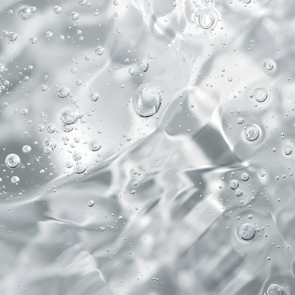 Clear gel with bubbles and light reflections.