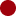 A pixelated green circular shape on a black background.
