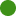 A pixelated green circular shape on a black background.
