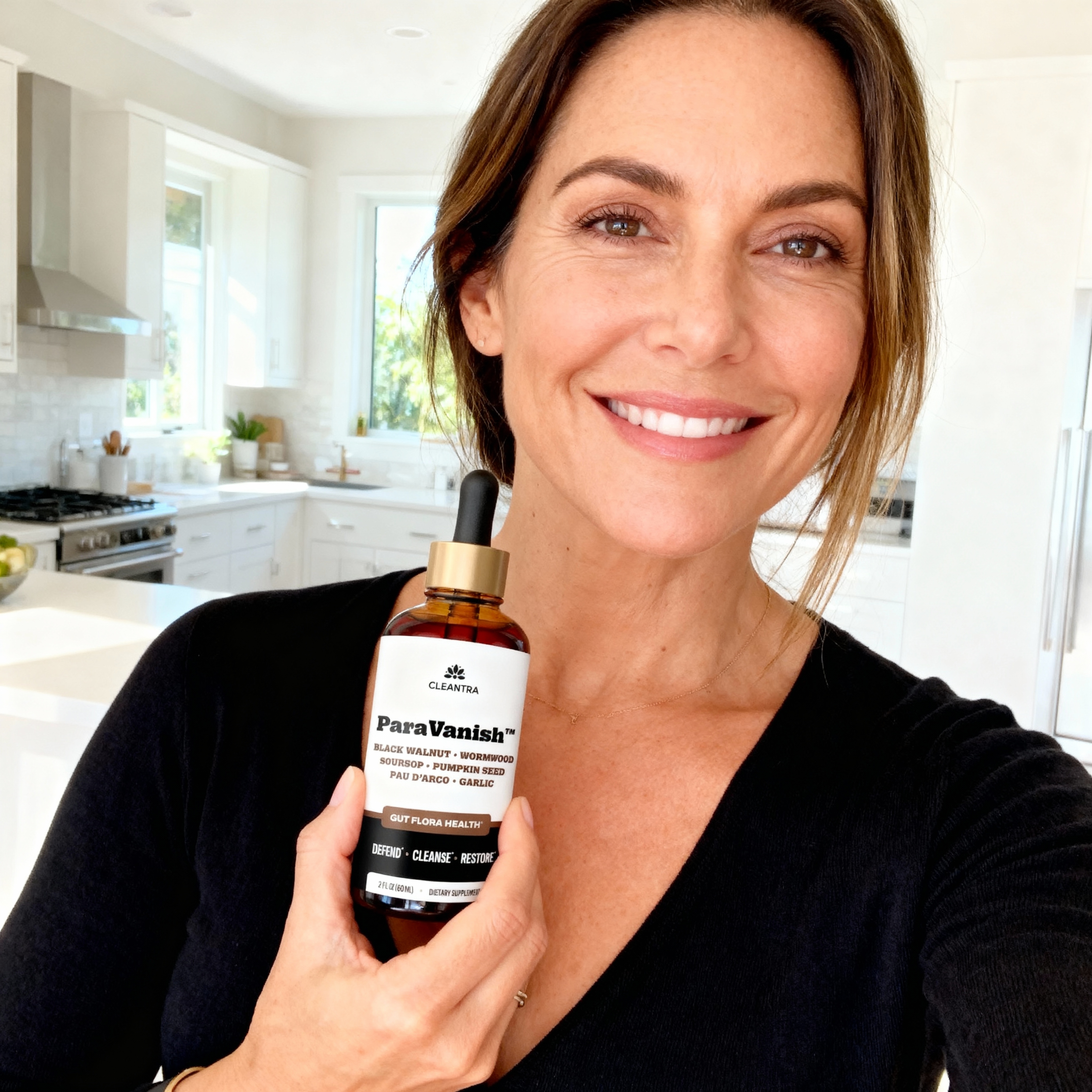 Person holding a bottle of dietary supplement in a kitchen.