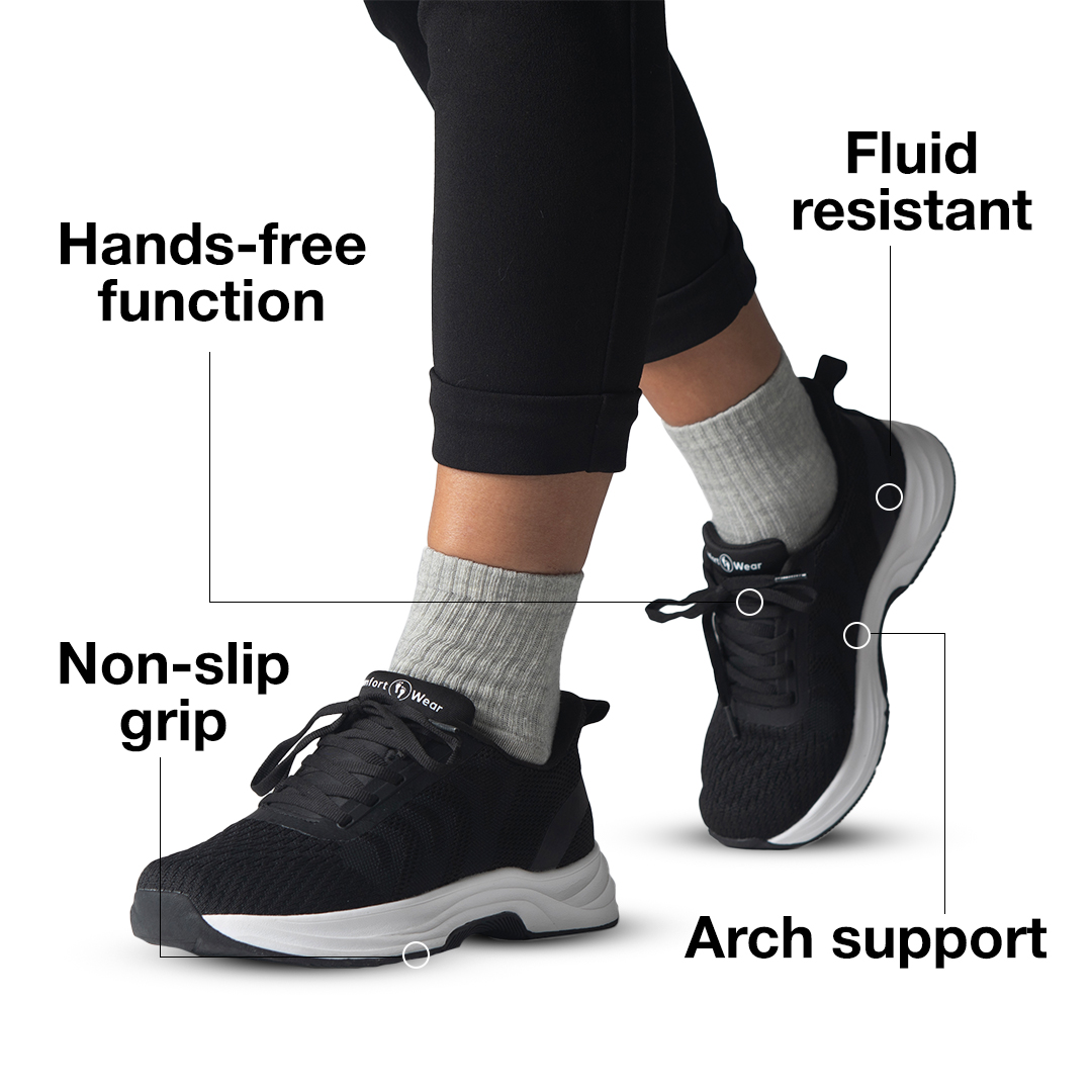 Person wearing black sneakers with features labeled: hands-free, non-slip, fluid resistant, arch support.