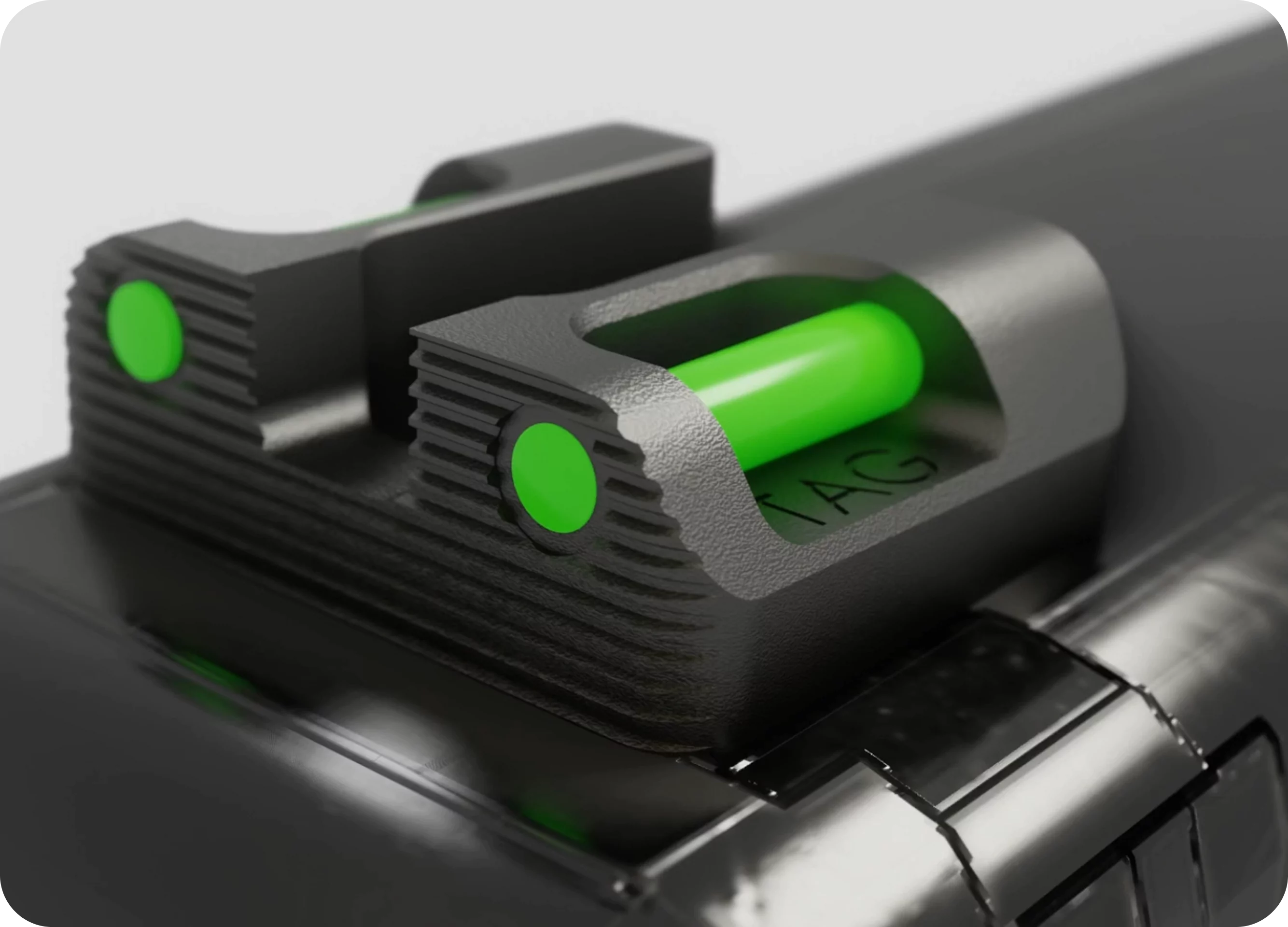 Close-up of a black and green gun sight on a firearm.