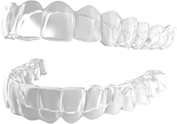 Clear dental aligners on a white background.