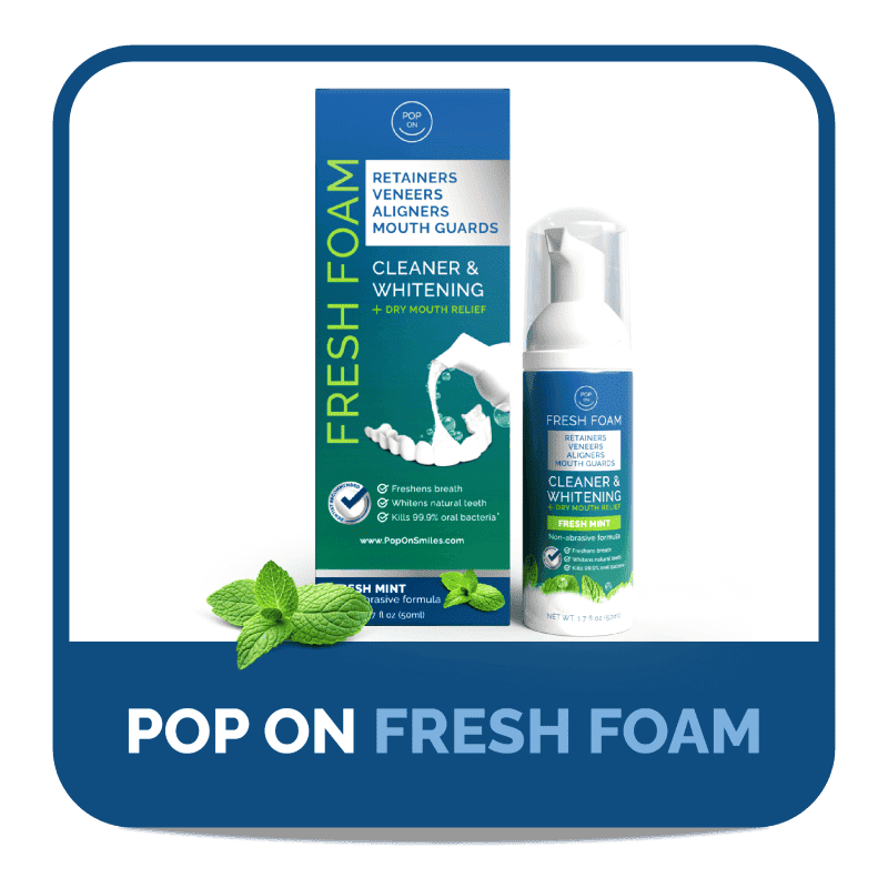 Dental cleaner and whitening foam with mint leaves and packaging.