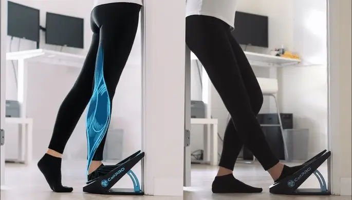 Person stretching legs using a calf stretcher in a home setting.
