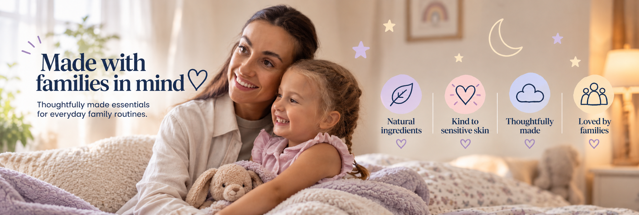 A smiling mother and young daughter cuddle on a couch while the girl holds a stuffed bunny.