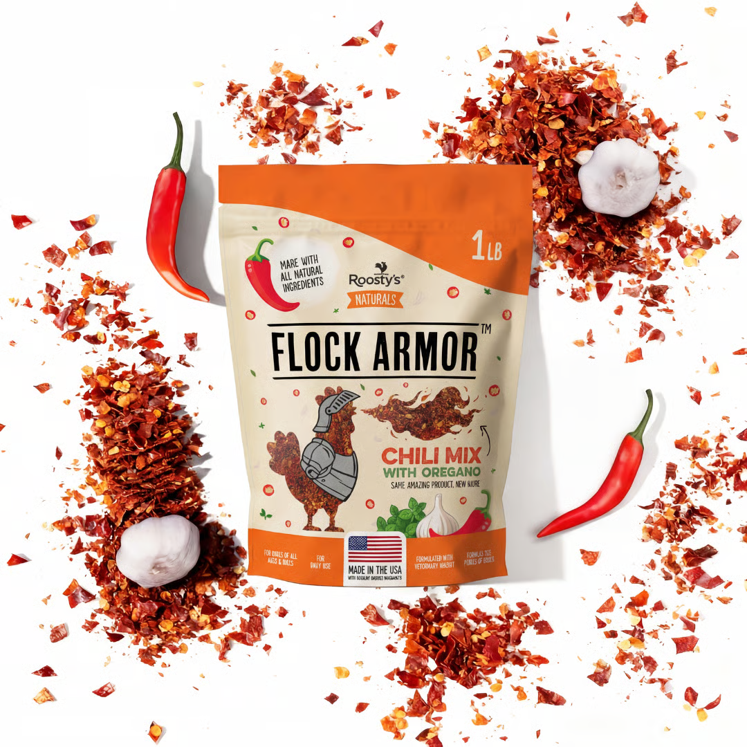 A bag of Flock Armor Chili Mix surrounded by red chili flakes, whole chili peppers, and garlic.