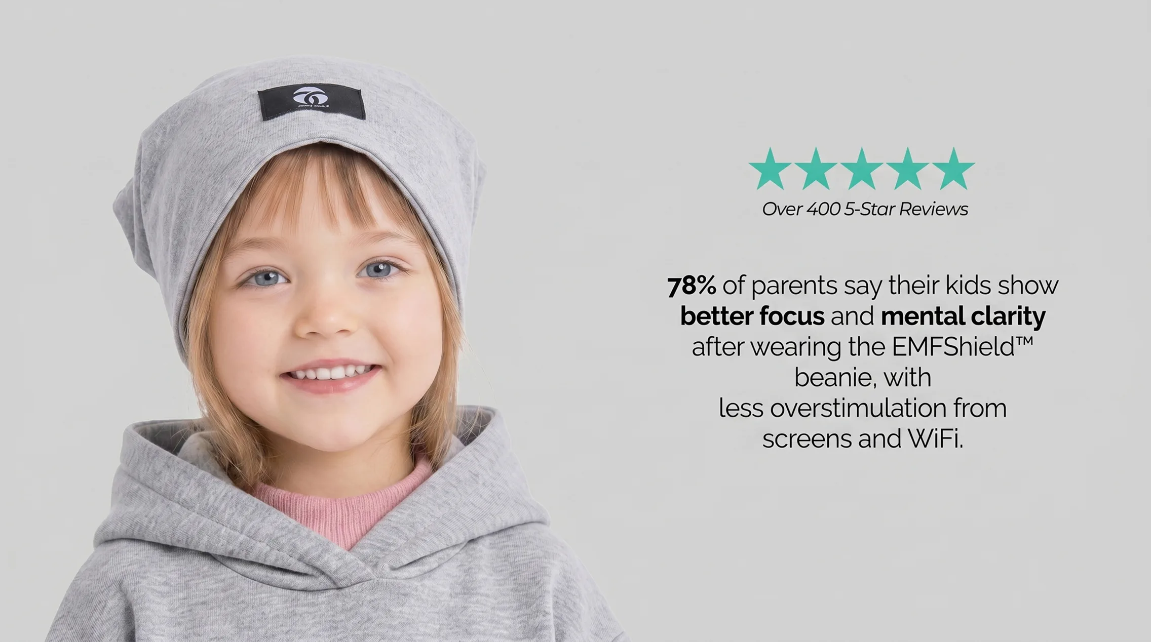A smiling young child wearing a grey beanie and hoodie, next to promotional text about the product.