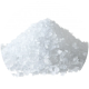 A pile of coarse white salt on a white background.
