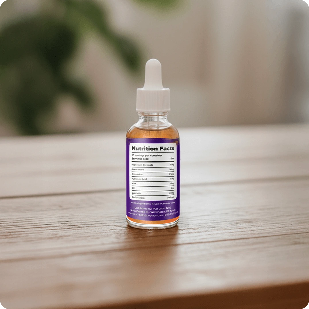 Clear dropper bottle with purple label on wooden surface.