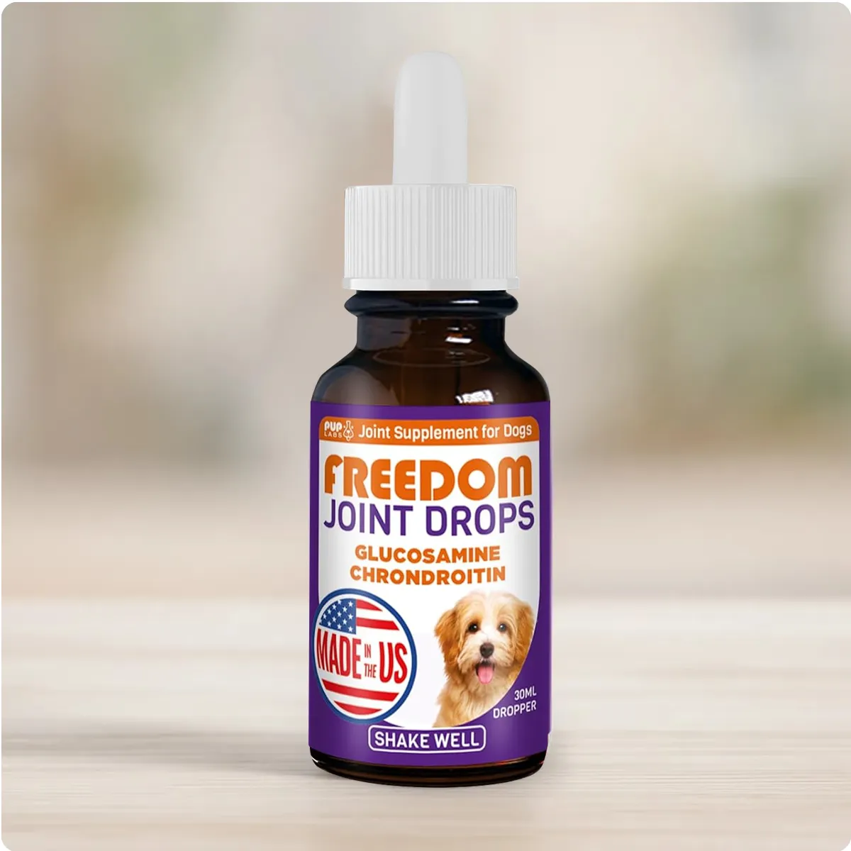 Bottle of Freedom Joint Drops for dogs on a light background.