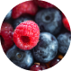 Close-up of fresh raspberries and blueberries.