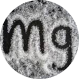 Black letters 'mg' on a textured gray circular background.